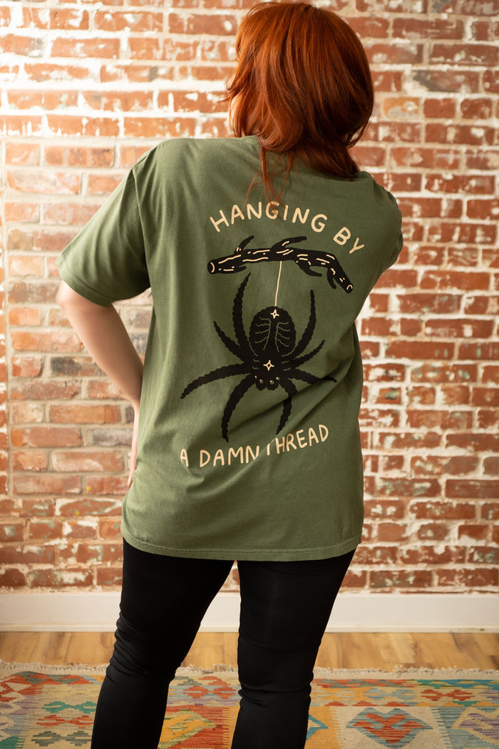Hanging by a Thread T-Shirt | Woodsy Green