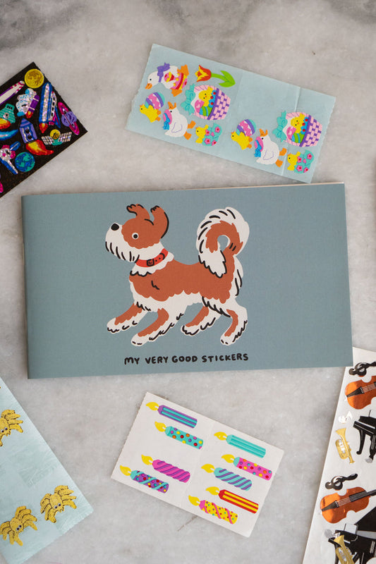 Sticker album with a dog and "my very good stickers" printed on the cover